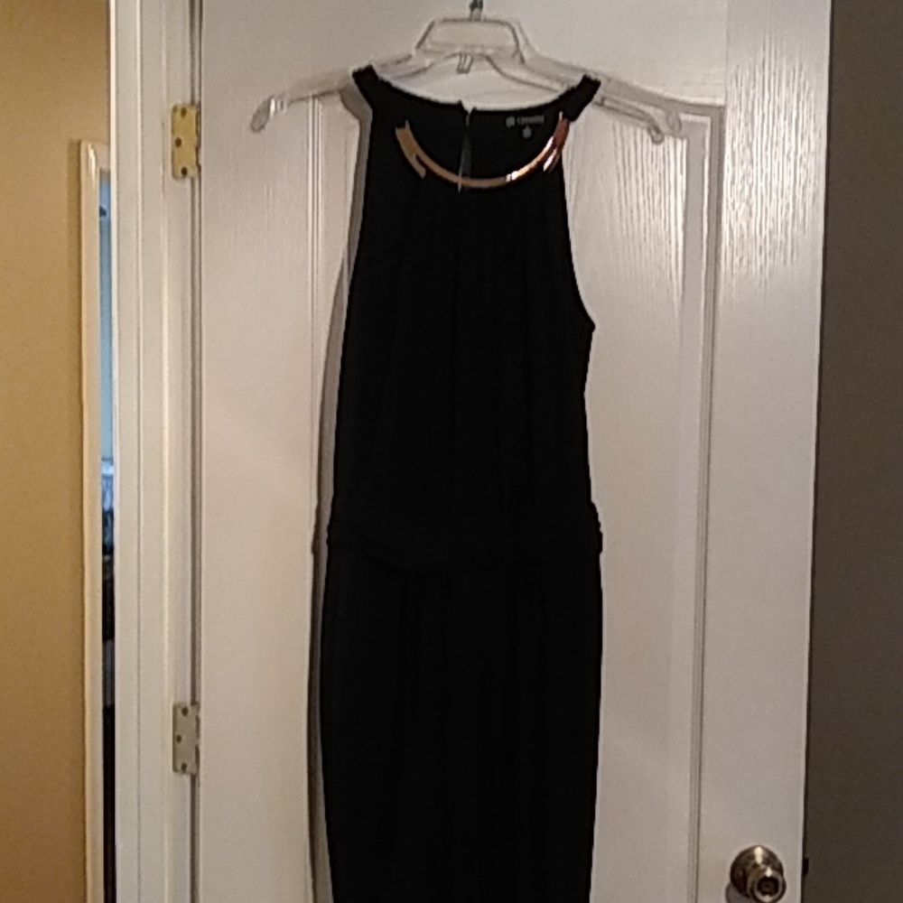 Black jumpsuit, shirred waist with gold bar at nec